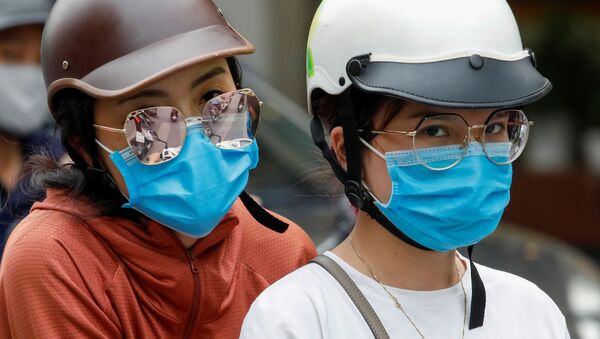 Девушки в защитных масках во Вьетнаме - 俄罗斯卫星通讯社