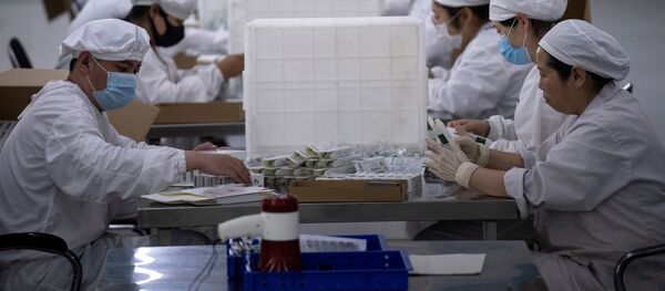Упаковка вакцин в компании Yisheng Biopharma, Китай - 俄羅斯衛星通訊社