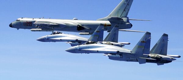 two Su-35 fighter jets and a H-6K bomber from the People's Liberation Army air force fly in formation during patrol that included the Luzon Straits also known as Bashi Straits near Taiwan. - 俄羅斯衛星通訊社