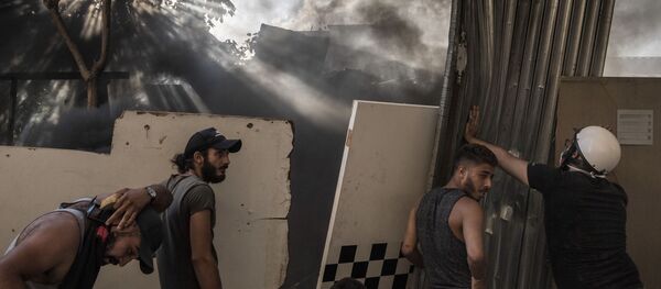 Участники столкновений между демонстрантами и силовиками в Бейруте - 俄羅斯衛星通訊社