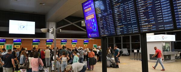 Пассажиры в международном аэропорту Шереметьево в Москве - 俄罗斯卫星通讯社