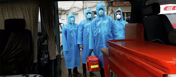 Волонтеры в защитных костюмах в Пакистане - 俄羅斯衛星通訊社