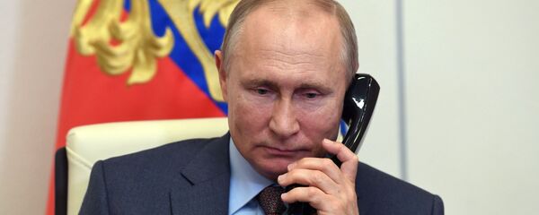 резидент РФ Владимир Путин во время встречи в режиме видеоконференции с председателем правительства РФ Михаилом Мишустиным - 俄罗斯卫星通讯社