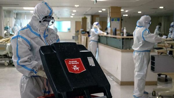 Врачи в защитных костюмах в больнице в Нью-Дели в Индии - 俄羅斯衛星通訊社