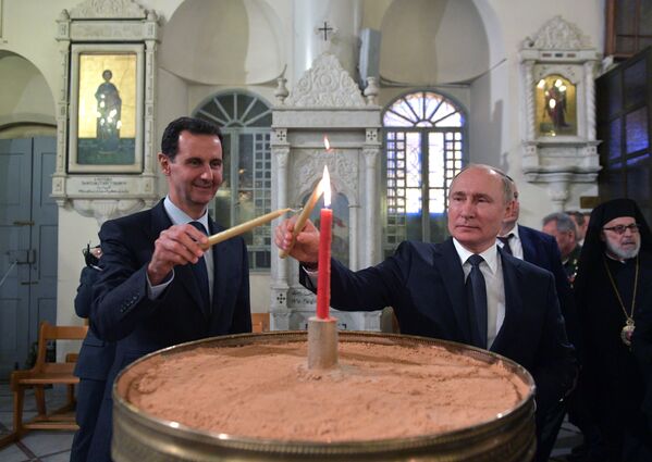 俄罗斯总统弗拉基米尔•普京和叙利亚总统巴沙尔•阿萨德在大马士革最神圣的圣母安息主教座堂内 - 俄罗斯卫星通讯社