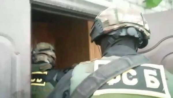Сотрудники ФСБ РФ во время спецоперации по задержанию членов экстремистской организации.  - 俄羅斯衛星通訊社