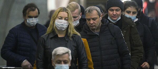 Пассажиры на одной из станций Московского метрополитена. - 俄罗斯卫星通讯社