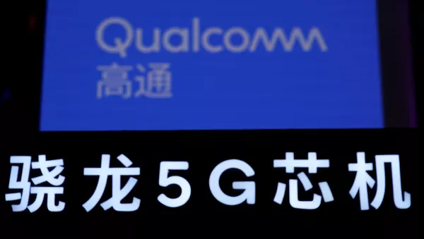 Лого Qualcomm на выставке China International Import Expo (CIIE) в Шанхае - 俄羅斯衛星通訊社