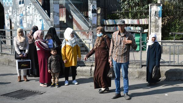 Местные жители на одной из улиц города Дамаска - 俄罗斯卫星通讯社