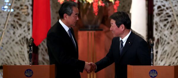 Главы МИД Китая и Японии Ван и Тосимицу Мотэги. Архивное фото - 俄羅斯衛星通訊社