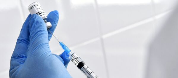 Медсестра во время вакцинации врачей Краевой клинической больницы в Краснодаре Медсестра во время вакцинации врачей Краевой клинической больницы в Краснодаре - 俄羅斯衛星通訊社