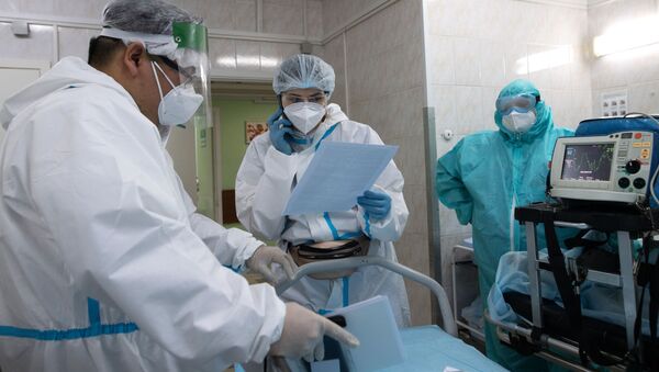 Медицинские работники в приемном отделении госпиталя COVID-19 в городской клинической больнице № 52 в Москве.  - 俄罗斯卫星通讯社