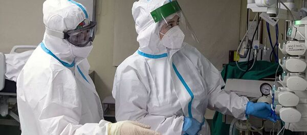 Медицинские работники в отделении реанимации и интенсивной терапии в госпитале COVID-19 в городской клинической больнице № 52 в Москве - 俄羅斯衛星通訊社