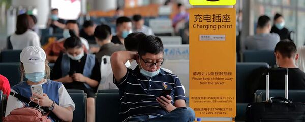 Пассажиры в аэропорту в Пекине Пассажиры в аэропорту в Пекине - 俄罗斯卫星通讯社