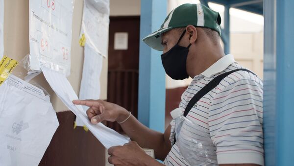  Мужчина в медицинской маске на избирательном участке во время голосования на выборах в Нацассамблею (однопалатный парламент) в Венесуэле. - 俄羅斯衛星通訊社
