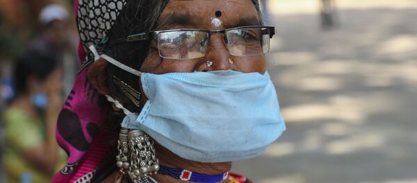 Женщина в маске. Индия - 俄罗斯卫星通讯社