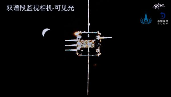 Chang'e-5 ascender is seen from the orbiter-returner combination in this handout image provided by China National Space Administration (CNSA) December 6, 2020.  - 俄罗斯卫星通讯社