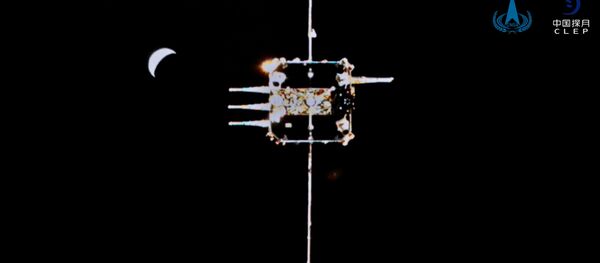 Chang'e-5 ascender is seen from the orbiter-returner combination in this handout image provided by China National Space Administration (CNSA) December 6, 2020.  - 俄罗斯卫星通讯社