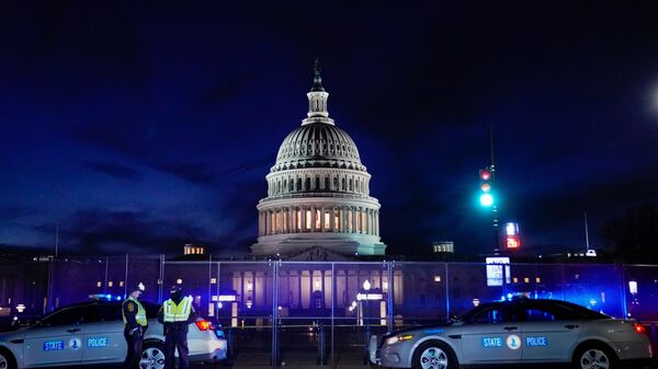 The U.S. Capitol is seen behind heavy-duty security fencing the day after supporters of U.S. President Donald Trump stormed the Capitol in Washington, U.S., January 7, 2021. - 俄羅斯衛星通訊社