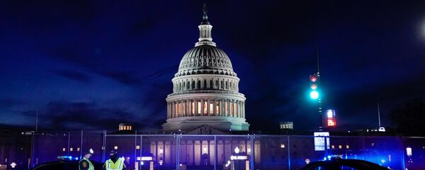 The U.S. Capitol is seen behind heavy-duty security fencing the day after supporters of U.S. President Donald Trump stormed the Capitol in Washington, U.S., January 7, 2021. - 俄罗斯卫星通讯社
