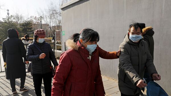 Люди в масках на улице Пекина - 俄羅斯衛星通訊社
