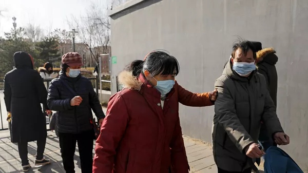 Люди в масках на улице Пекина - 俄罗斯卫星通讯社
