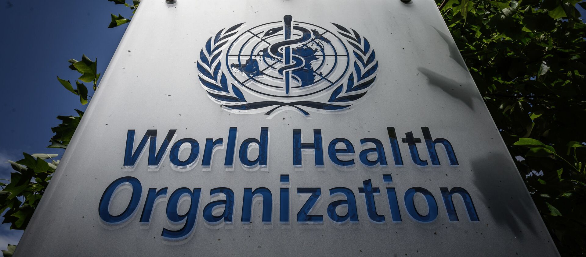 This photograph taken on July 3, 2020, shows a sign of the World Health Organization (WHO) at their headquarters in Geneva, amidst the COVID-19 outbreak, caused by the novel coronavirus. - 俄羅斯衛星通訊社, 1920, 24.05.2021