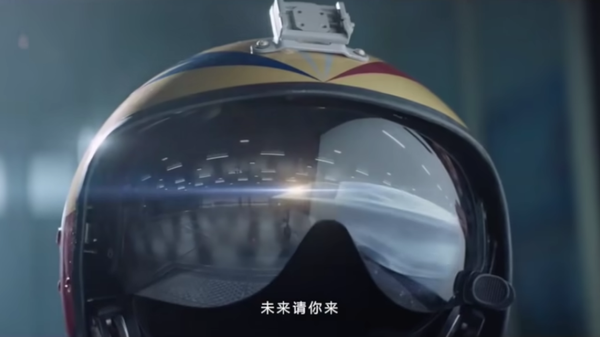 A teased image of China's forthcoming H-20 stealth bomber, seen reflected in the pilot's helmet as a sheet is pulled away from the nose. Image taken from a People's Liberation Army Air Force promotional video. - 俄罗斯卫星通讯社