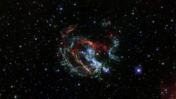 Снимок остаточных струй сверхновой 1E 0102.2-7219, сделанный космическим телескопом Хаббл - 俄羅斯衛星通訊社