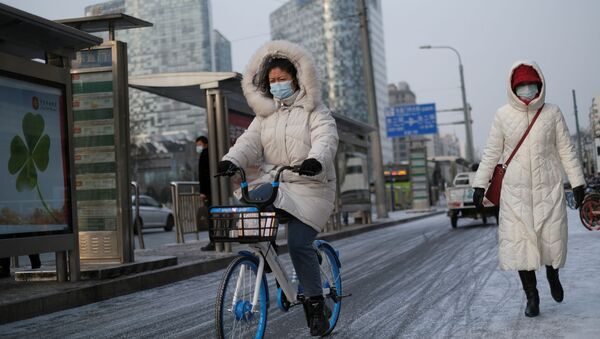 Женщина в маске. Пекин - 俄罗斯卫星通讯社