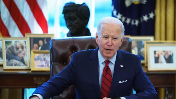 US President Joe Biden speaks before signing executive orders on health care, in the Oval Office of the White House in Washington, DC, on January 28, 2021.  - 俄羅斯衛星通訊社