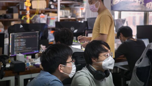 Мужчины в офисе в Пекине - 俄罗斯卫星通讯社