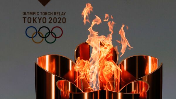 Олимпийский огонь во время эстафеты Олимпийского огня в Токио-2020 в префектуре Фукусима, Япония - 俄羅斯衛星通訊社