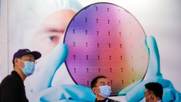 Люди на выставке полупроводниковых технологий Semicon China в Шанхае, Китай - 俄羅斯衛星通訊社