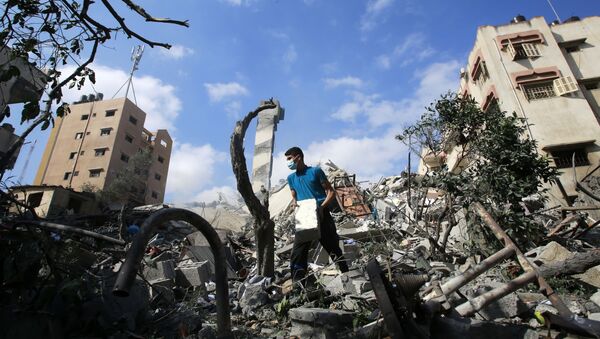 Разрушенное в результате бомбардировки здание в секторе Газа.  - 俄罗斯卫星通讯社