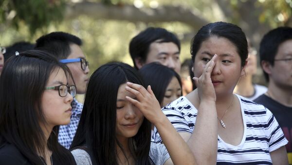 Китайцы во время похорон - 俄羅斯衛星通訊社