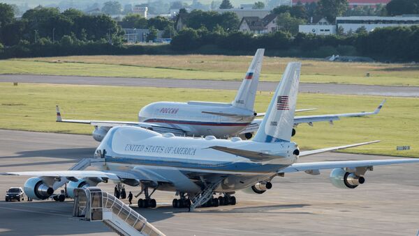 Air Force One, the Boeing-747 airplane of U.S. President Joe Biden, stands by, as the Iljuschin Il-96, presumably carrying Russian President Vladimir Putin, taxies to the runway after the US - Russia summit, on Geneva Airport Cointrin, Switzerland, June 16, 2021. Alessandro della Valle/Pool via REUTERS? - 俄罗斯卫星通讯社