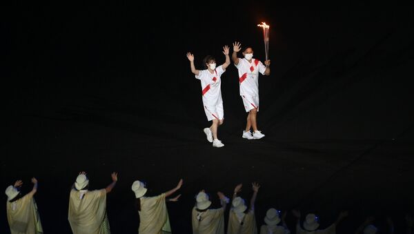 Факелоносцы на церемонии открытия XXXII летних Олимпийских игр в Токио. - 俄罗斯卫星通讯社
