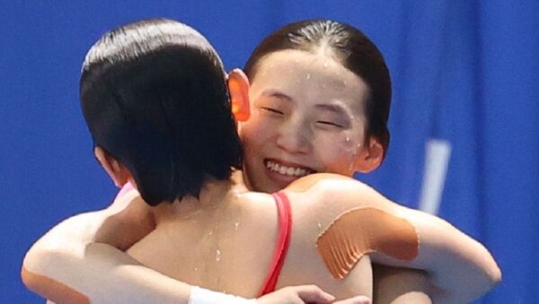 Chen Yuxi of China and Zhang Jiaqi of China reacts after winning - 俄羅斯衛星通訊社
