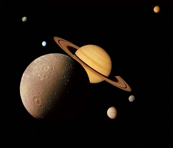  美國「旅行者1號」探測器拍攝到的土星與衛星迪俄涅的照片。 - 俄羅斯衛星通訊社