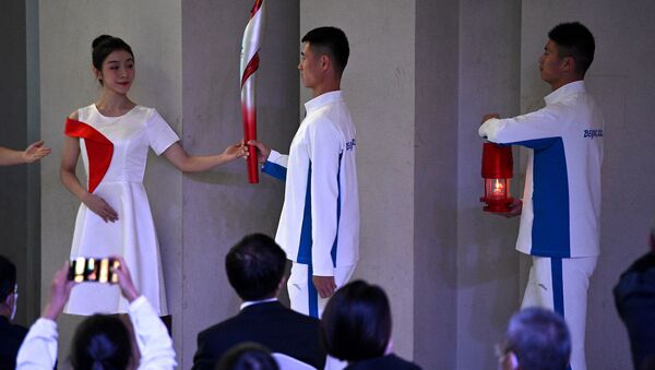 Факелоносцы на церемонии встречи олимпийского огня в Пекине  - 俄羅斯衛星通訊社