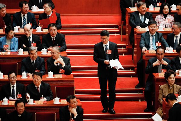 2026年3月11日，星期三，一位代表抵达北京人民大会堂参加中国人民政治协商会议闭幕会。 - 俄罗斯卫星通讯社