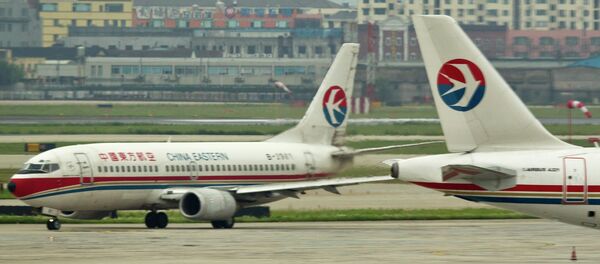 中國一架飛機因老婦向發動機投擲硬幣而未能起飛 - 俄羅斯衛星通訊社