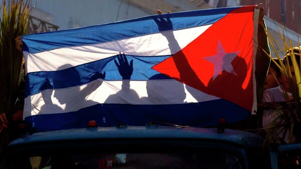 古巴“五一”游行庆典中一名反对派因手持美国国旗被拘捕 - 俄罗斯卫星通讯社