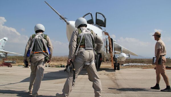 Российские летчики перед полетом у своего самолета в Сирии - 俄罗斯卫星通讯社