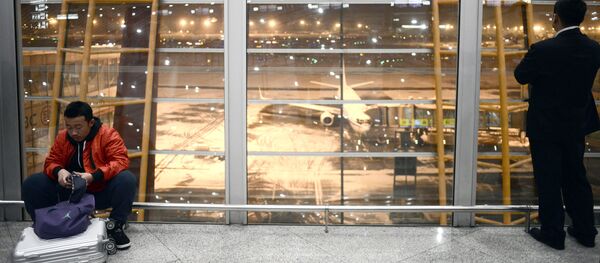 Пассажиры ждут своих рейсов в аэропорту Пекина в Китае - 俄罗斯卫星通讯社