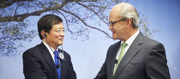 Michel Demare & Ren Jianxin - 俄罗斯卫星通讯社