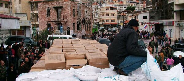 俄驻叙冲突各方调解中心称俄一昼夜向叙居民转交12吨食品 - 俄罗斯卫星通讯社