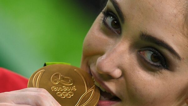 揭秘：奧運獎牌得主為何都咬獎牌 - 俄羅斯衛星通訊社