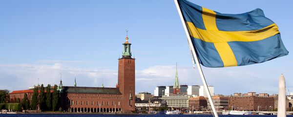 Шведский флаг на фоне Стокгольмской ратуши - 俄羅斯衛星通訊社